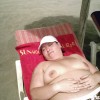 sunbathing on beach topless